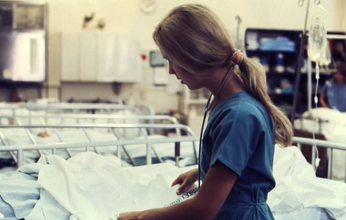 Nurse providing care to a patient in hospital