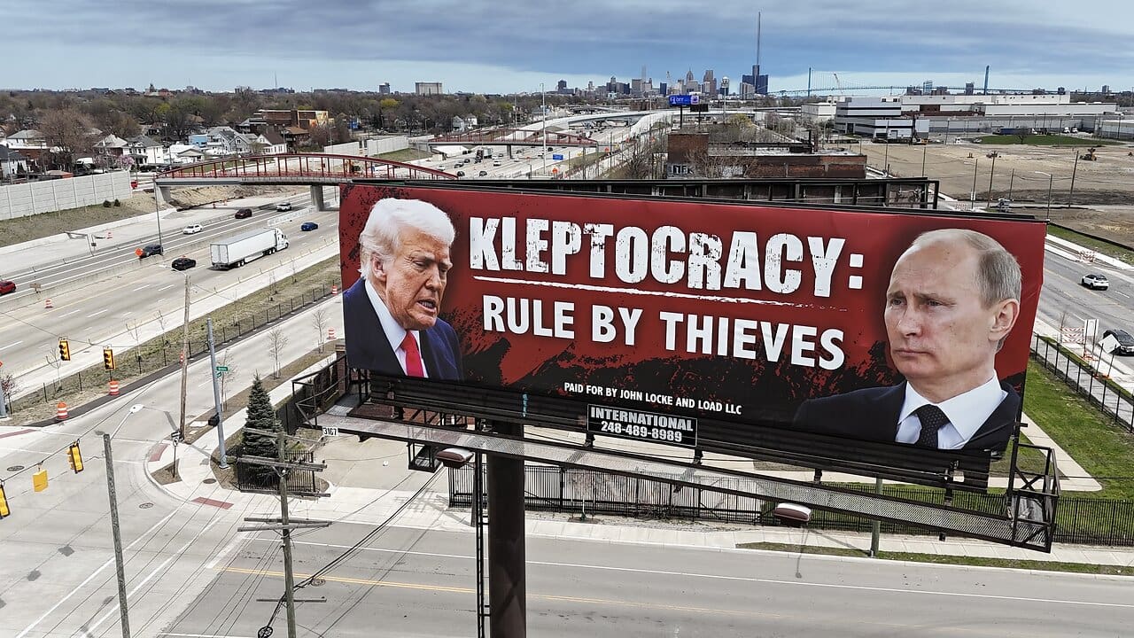 Kleptocracy billboard with images of Putin and Trump