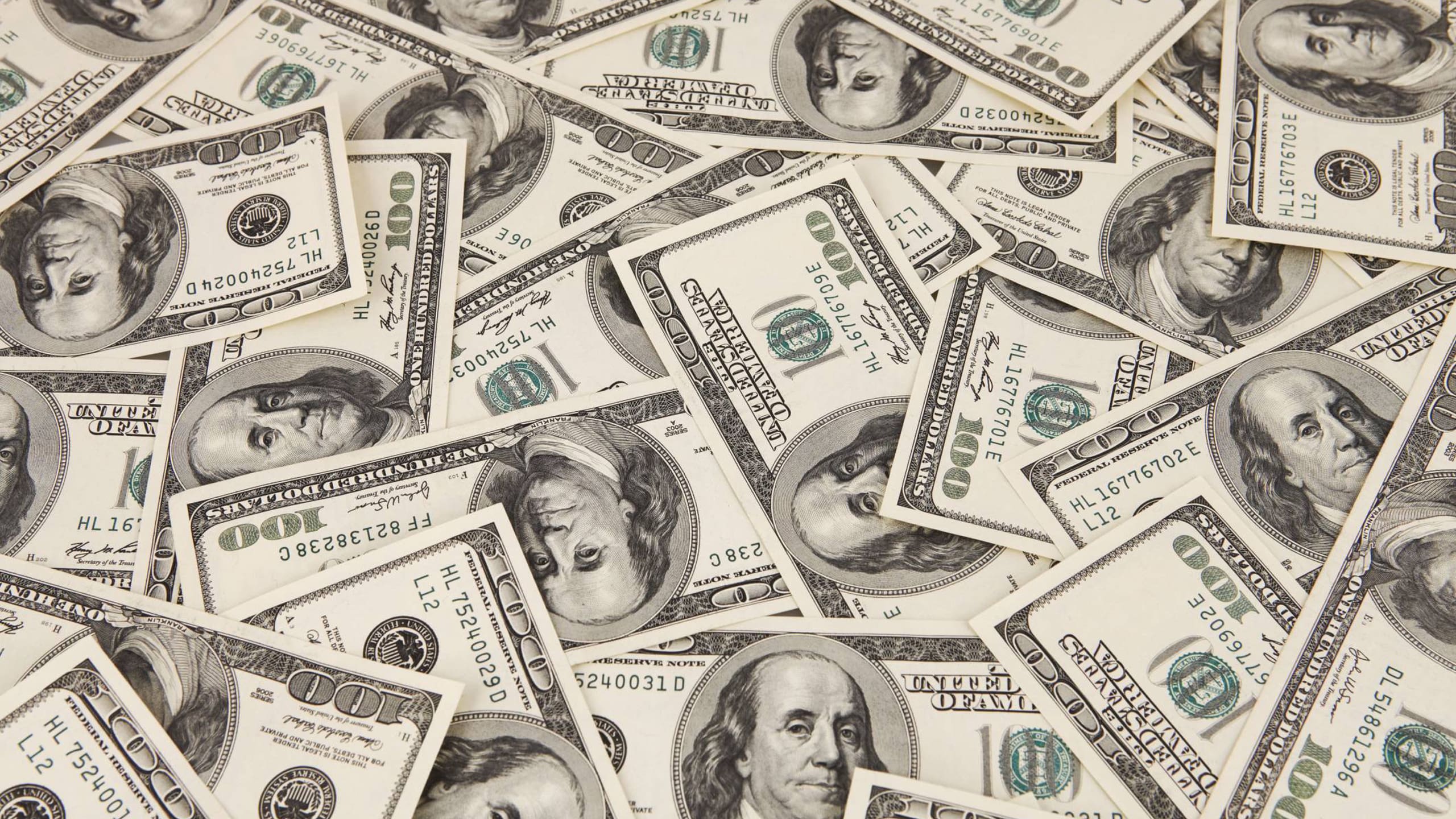 Pile of one hundred dollar bills
